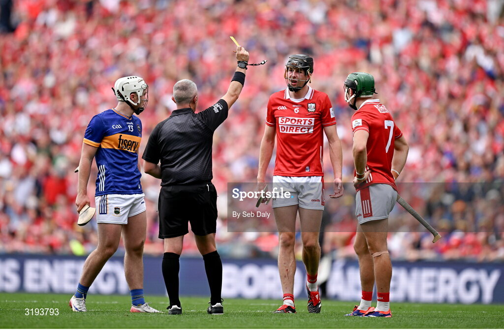 20 July 2025; Robert Downey of Cork is shown a yellow card by referee Liam Gordon during the GAA Hurling All-Ireland Senior Championship final match between Cork and Tipperary at Croke Park in Dublin. Photo by Seb Daly/Sportsfile