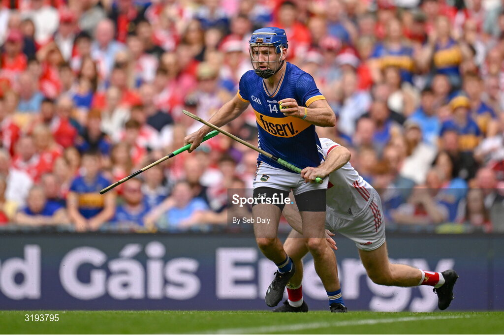 20 July 2025; John McGrath of Tipperary is tackled by Cork goalkeeper Patrick Collins during the GAA Hurling All-Ireland Senior Championship final match between Cork and Tipperary at Croke Park in Dublin. Photo by Seb Daly/Sportsfile