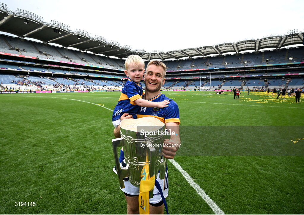 20 July 2025; John McGrath of Tipperary and his nephew Sam celebrate with the Liam MacCarthy cup after his side's victory in the GAA Hurling All-Ireland Senior Championship final match between Cork and Tipperary at Croke Park in Dublin. Photo by Stephen McCarthy/Sportsfile