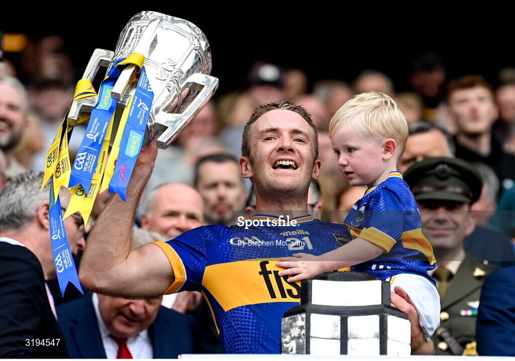 20 July 2025; Noel McGrath of Tipperary and his son Sam lift the Liam MacCarthy cup after victory in the GAA Hurling All-Ireland Senior Championship final match between Cork and Tipperary at Croke Park in Dublin. Photo by Stephen McCarthy/Sportsfile
