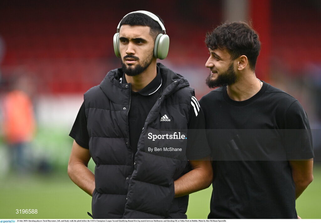 23 July 2025; Qarabag players Tural Bayramov, left, and Kady walk the pitch before the UEFA Champions League Second Qualifying Round first leg match between Shelbourne and Qarabag FK at Tolka Park in Dublin. Photo by Ben McShane/Sportsfile