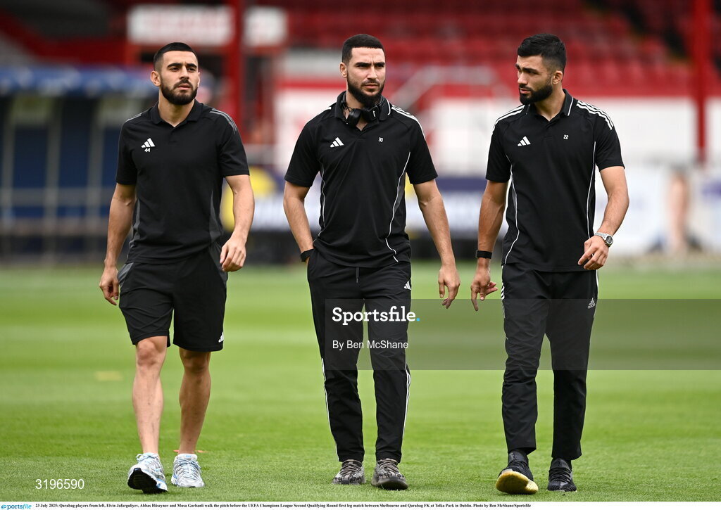23 July 2025; Qarabag players from left, Elvin Jafarguliyev, Abbas Hüseynov and Musa Gurbanli walk the pitch before the UEFA Champions League Second Qualifying Round first leg match between Shelbourne and Qarabag FK at Tolka Park in Dublin. Photo by Ben McShane/Sportsfile