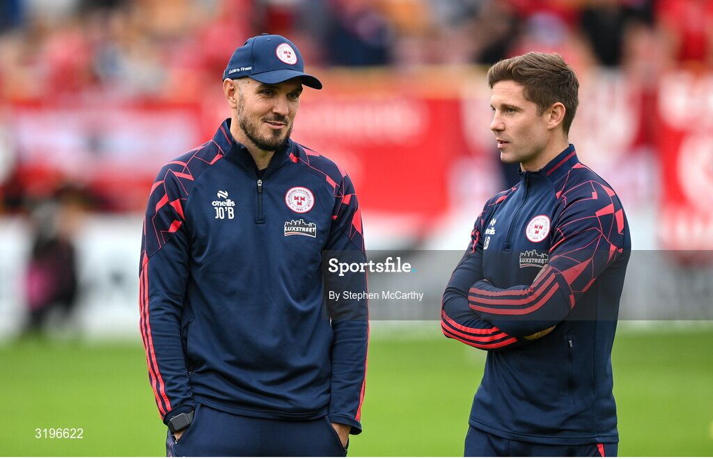 23 July 2025; Shelbourne head coach Joey O'Brien, left, and Shelbourne technical director Luke Byrne during the UEFA Champions League Second Qualifying Round first leg match between Shelbourne and Qarabag FK at Tolka Park in Dublin. Photo by Stephen McCarthy/Sportsfile