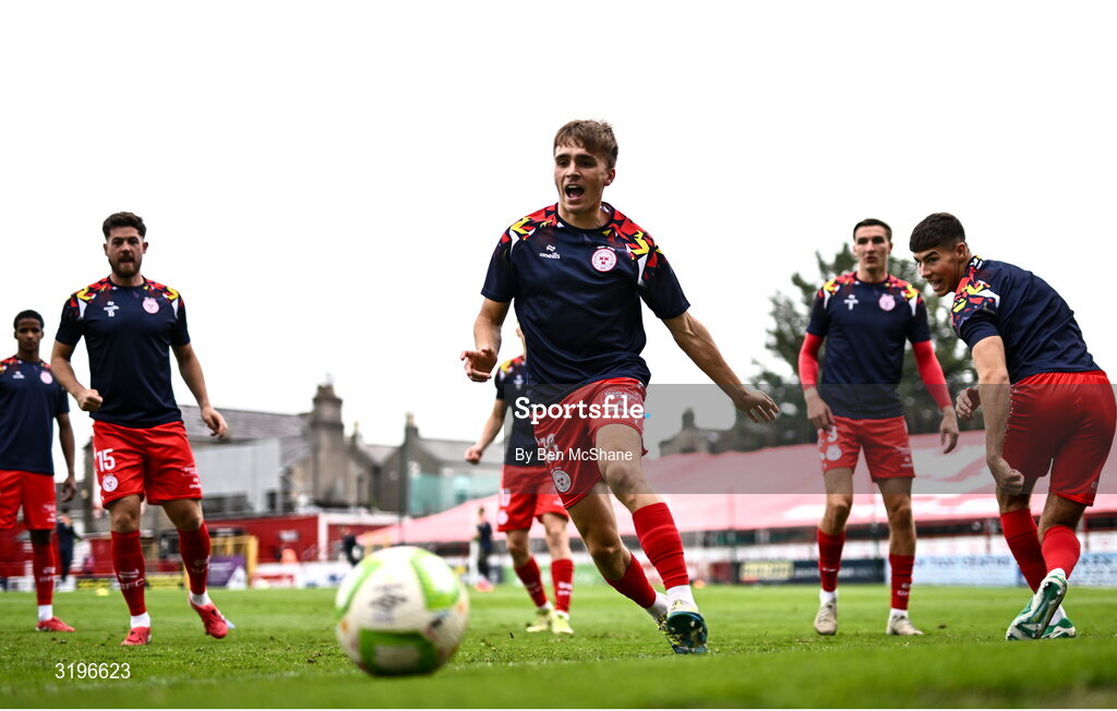 23 July 2025; Shelbourne players including James Norris, centre, warm up before the UEFA Champions League Second Qualifying Round first leg match between Shelbourne and Qarabag FK at Tolka Park in Dublin. Photo by Ben McShane/Sportsfile