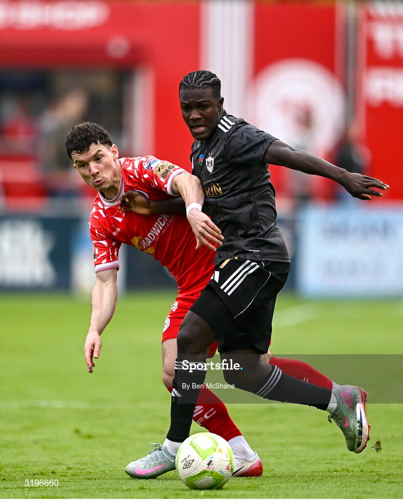 23 July 2025; Emmanuel Addai of Qarabag in action against Ali Coote of Shelbourne during the UEFA Champions League Second Qualifying Round first leg match between Shelbourne and Qarabag FK at Tolka Park in Dublin. Photo by Ben McShane/Sportsfile