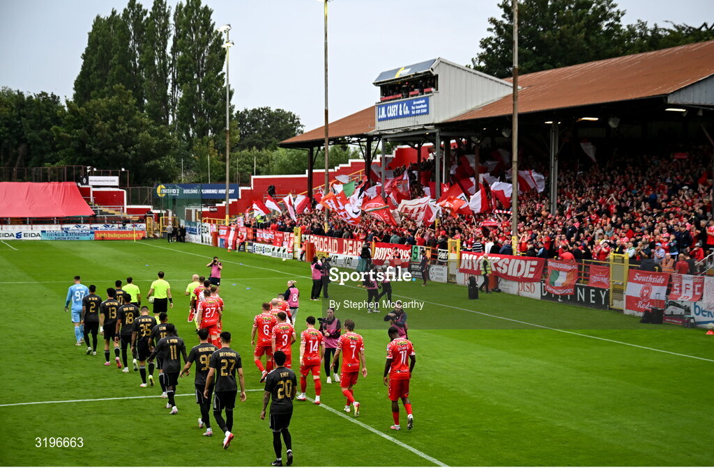 23 July 2025; Players and officials make their way on to the pitch before the UEFA Champions League Second Qualifying Round first leg match between Shelbourne and Qarabag FK at Tolka Park in Dublin. Photo by Stephen McCarthy/Sportsfile