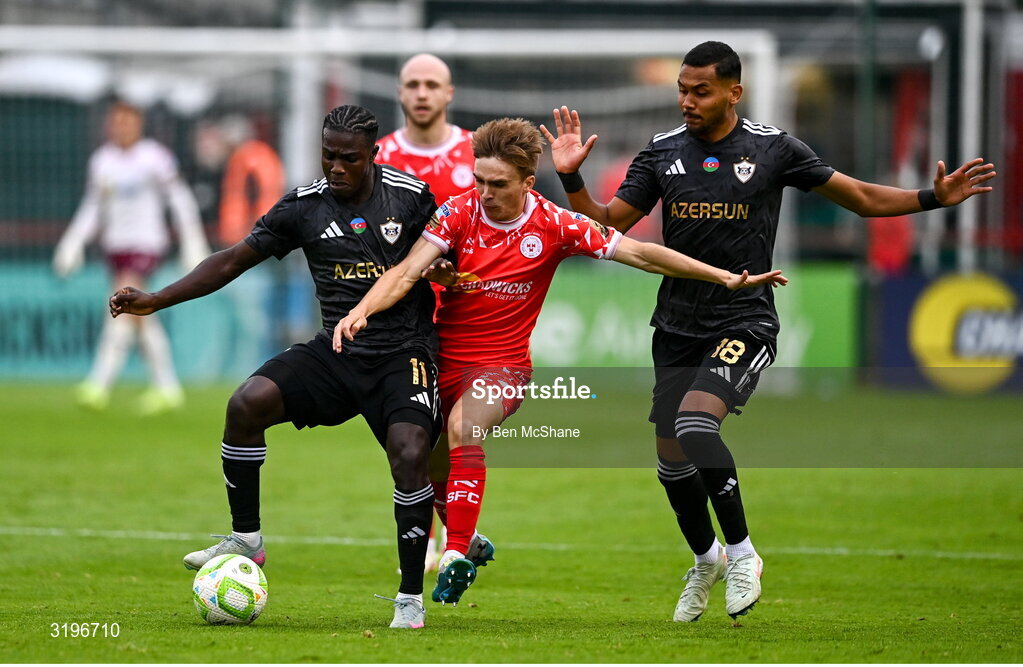 23 July 2025; James Norris of Shelbourne in action against Emmanuel Addai, left, and Dani Bolt of Qarabag during the UEFA Champions League Second Qualifying Round first leg match between Shelbourne and Qarabag FK at Tolka Park in Dublin. Photo by Ben McShane/Sportsfile