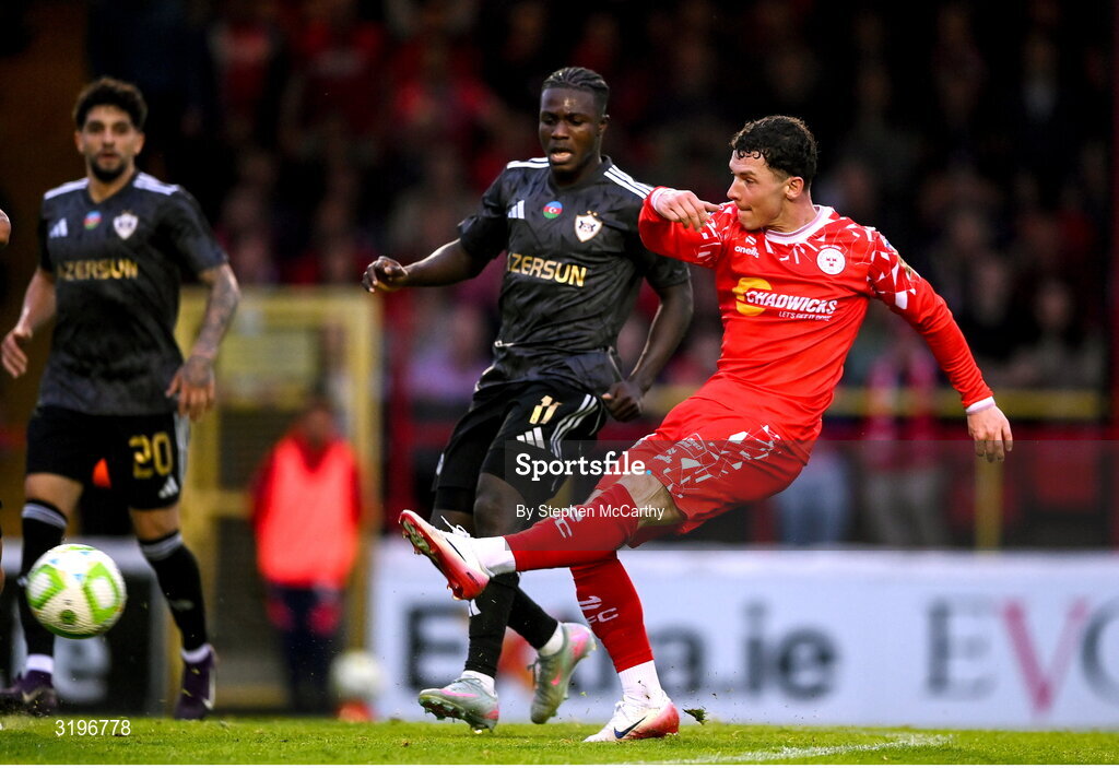 23 July 2025; Ali Coote of Shelbourne has a shot on goal under pressure from Emmanuel Addai of Qarabag during the UEFA Champions League Second Qualifying Round first leg match between Shelbourne and Qarabag FK at Tolka Park in Dublin. Photo by Stephen McCarthy/Sportsfile