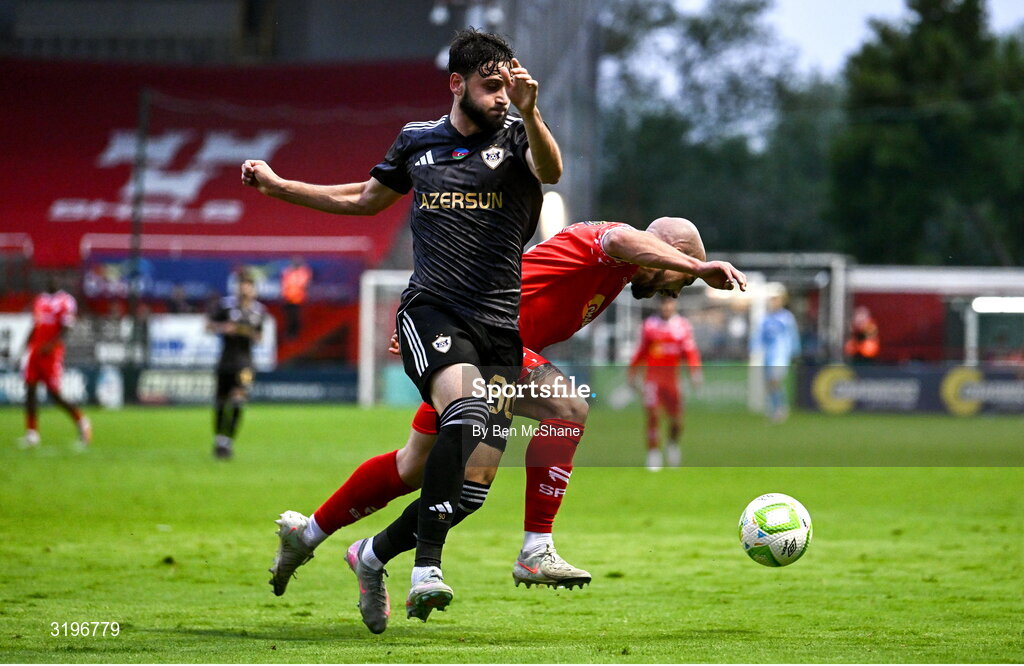 23 July 2025; Mark Coyle of Shelbourne is tackled by Nariman Akhundzade of Qarabag during the UEFA Champions League Second Qualifying Round first leg match between Shelbourne and Qarabag FK at Tolka Park in Dublin. Photo by Ben McShane/Sportsfile