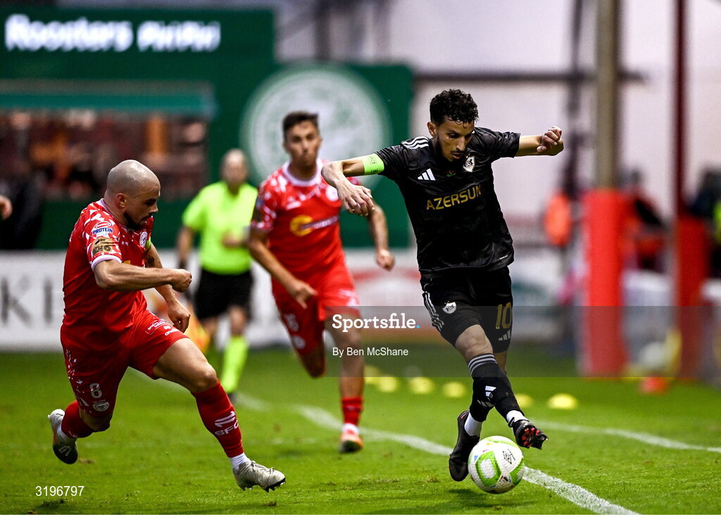 23 July 2025; Abdellah Zoubir of Qarabag in action against Mark Coyle of Shelbourne during the UEFA Champions League Second Qualifying Round first leg match between Shelbourne and Qarabag FK at Tolka Park in Dublin. Photo by Ben McShane/Sportsfile