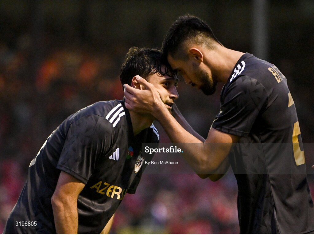 23 July 2025; Nariman Akhundzade of Qarabag, left, is congratulated by teammate Tural Bayramov after scoring their side's third goal during the UEFA Champions League Second Qualifying Round first leg match between Shelbourne and Qarabag FK at Tolka Park in Dublin. Photo by Ben McShane/Sportsfile