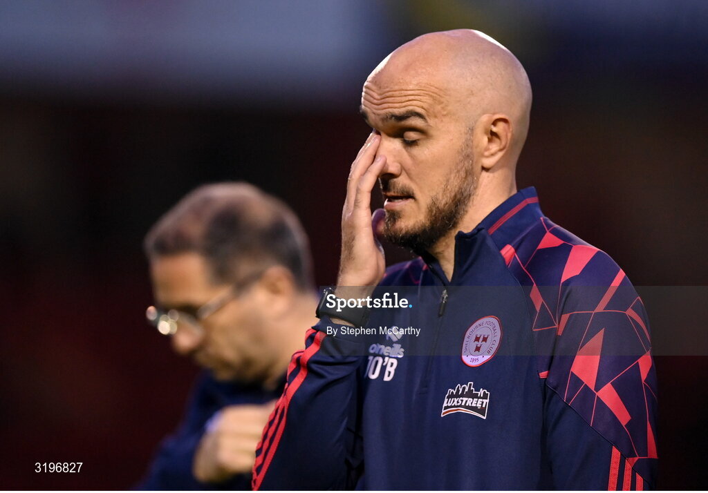 23 July 2025; Shelbourne head coach Joey O'Brien dejected after his side's defeat in the UEFA Champions League Second Qualifying Round first leg match between Shelbourne and Qarabag FK at Tolka Park in Dublin. Photo by Stephen McCarthy/Sportsfile