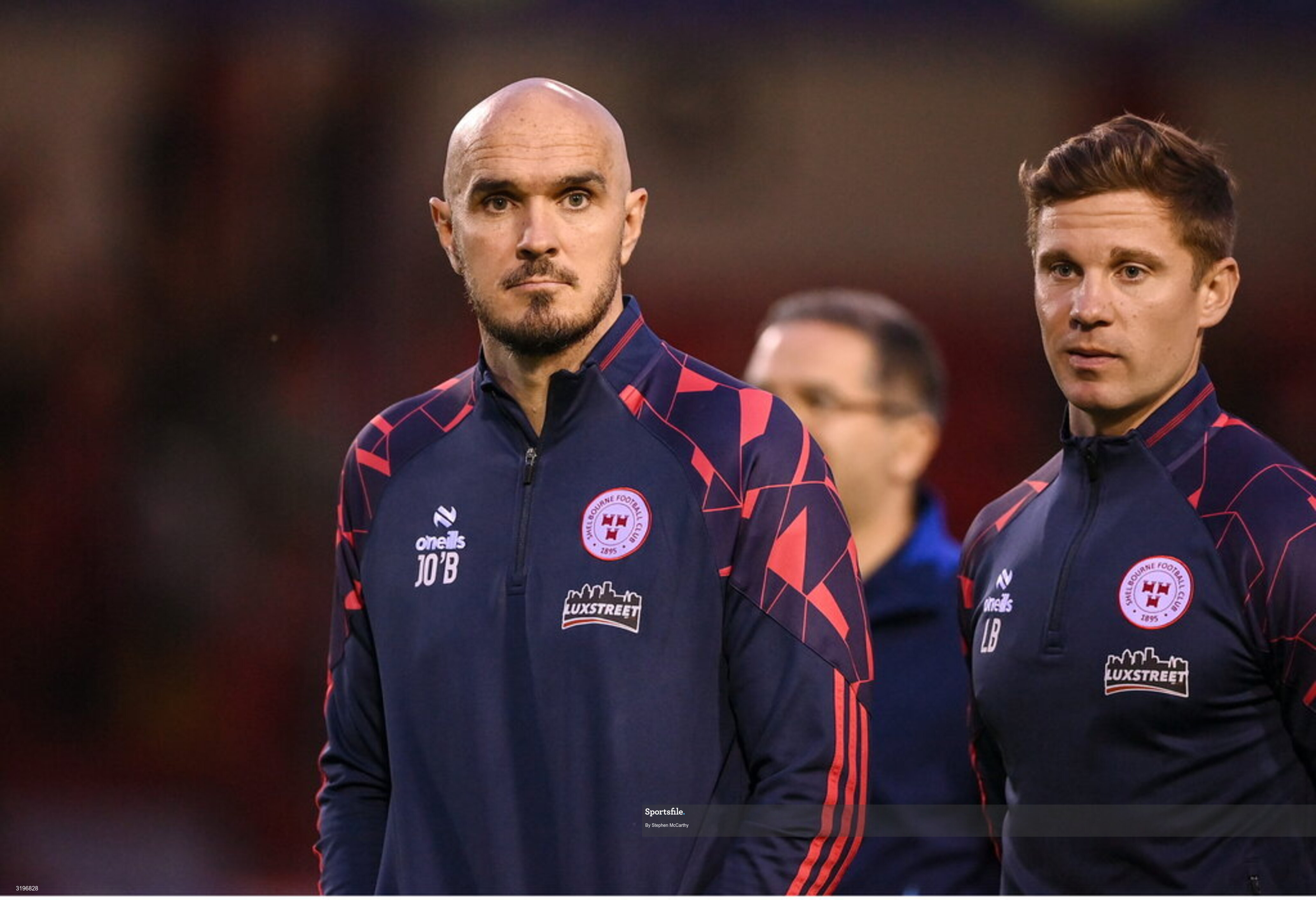 23 July 2025; Shelbourne head coach Joey O'Brien, left, and Shelbourne technical director Luke Byrne after their side's defeat in the UEFA Champions League Second Qualifying Round first leg match between Shelbourne and Qarabag FK at Tolka Park in Dublin. Photo by Stephen McCarthy/Sportsfile