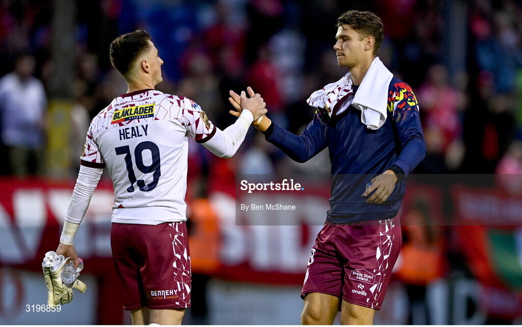 23 July 2025; Shelbourne goalkeeper Lorcan Healy, left, and Shelbourne goalkeeper Wessel Speel, shake hands after their side's defeat in the UEFA Champions League Second Qualifying Round first leg match between Shelbourne and Qarabag FK at Tolka Park in Dublin. Photo by Ben McShane/Sportsfile