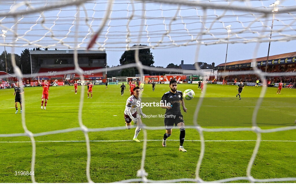 23 July 2025; Nariman Akhundzade of Qarabag scores his side's third goal despite the efforts of Shelbourne goalkeeper Lorcan Healy during the UEFA Champions League Second Qualifying Round first leg match between Shelbourne and Qarabag FK at Tolka Park in Dublin. Photo by Stephen McCarthy/Sportsfile