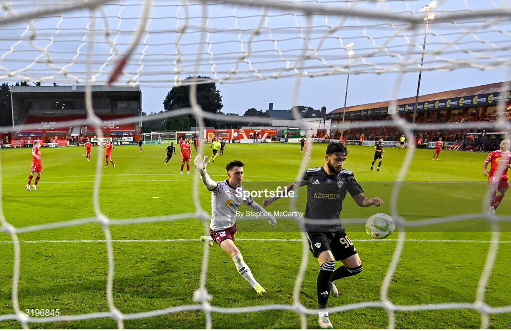 23 July 2025; Nariman Akhundzade of Qarabag scores his side's third goal despite the efforts of Shelbourne goalkeeper Lorcan Healy during the UEFA Champions League Second Qualifying Round first leg match between Shelbourne and Qarabag FK at Tolka Park in Dublin. Photo by Stephen McCarthy/Sportsfile