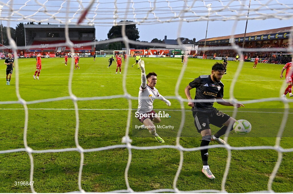 23 July 2025; Nariman Akhundzade of Qarabag scores his side's third goal despite the efforts of Shelbourne goalkeeper Lorcan Healy during the UEFA Champions League Second Qualifying Round first leg match between Shelbourne and Qarabag FK at Tolka Park in Dublin. Photo by Stephen McCarthy/Sportsfile