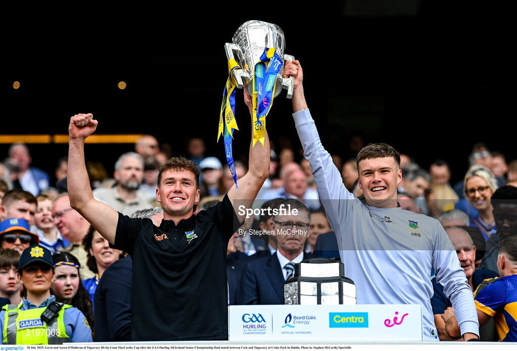 20 July 2025; Gavin and Aaron O'Halloran of Tipperary lift the Liam MacCarthy Cup after the GAA Hurling All-Ireland Senior Championship final match between Cork and Tipperary at Croke Park in Dublin. Photo by Stephen McCarthy/Sportsfile