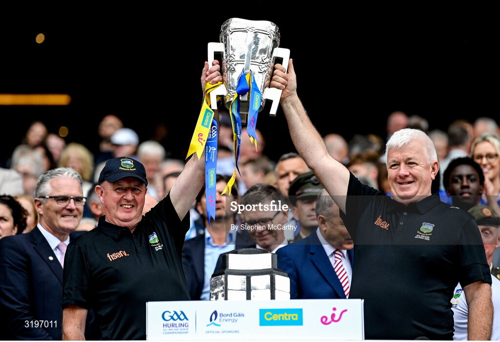 20 July 2025; Tipperary Team Liason Officer John Smith and Logistics Officor Michael Bourke lift the Liam MacCarthy Cup after the GAA Hurling All-Ireland Senior Championship final match between Cork and Tipperary at Croke Park in Dublin. Photo by Stephen McCarthy/Sportsfile