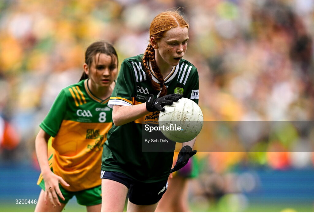 27 July 2025; Niamh Fanning, St Laurence O'Toole's NS, Roundwood, Wicklow, representing Kerry, in action against Grainne Owens, St Matthew's PS, Castlewellan, Down, representing Donegal, during the GAA INTO Cumann na mBunscol Respect Exhibition Go Games at the GAA Football All-Ireland Senior Championship final match between Kerry and Donegal at Croke Park in Dublin. Photo by Seb Daly/Sportsfile