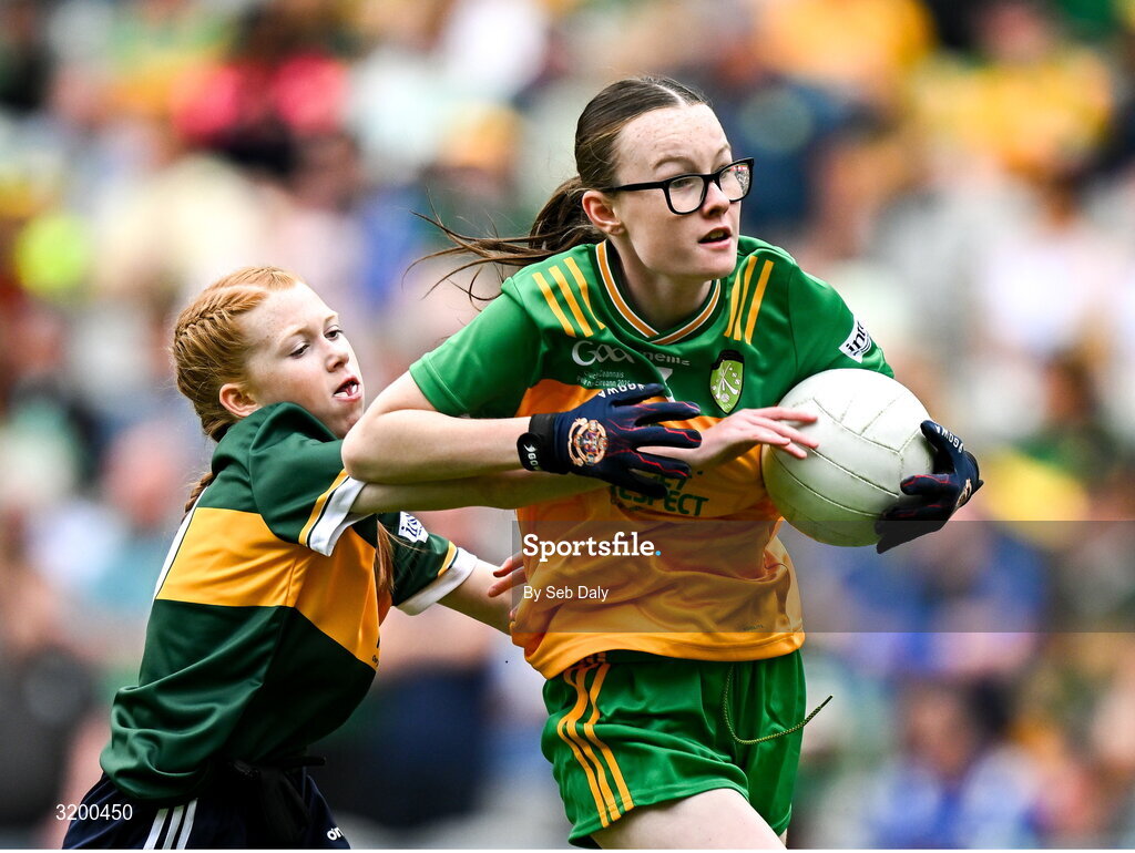 27 July 2025; Teegan Fahy, Clonberne NS, Clonberne, Galway, representing Donegal, in action against Bailee Bolton, St Fiacc's NS, Graiguecullen, Laois, representing Kerry, during the GAA INTO Cumann na mBunscol Respect Exhibition Go Games at the GAA Football All-Ireland Senior Championship final match between Kerry and Donegal at Croke Park in Dublin. Photo by Seb Daly/Sportsfile