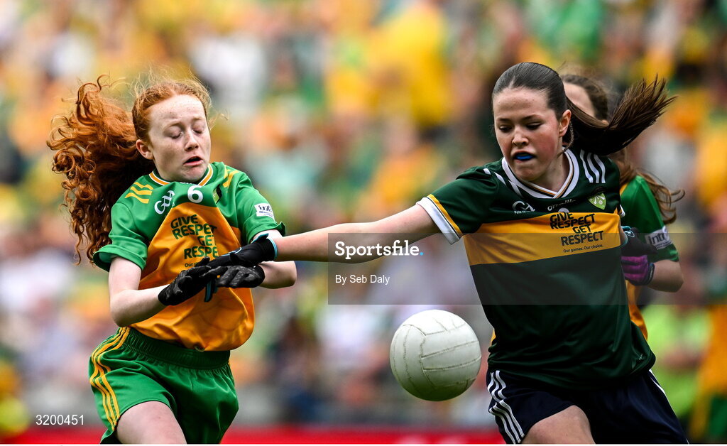 27 July 2025; Úna Kilkenny, St Mary's PS, Mullaghbawn, Armagh, representing Donegal, in action against Ella Roche, Moveen NS, Kilkee, Clare, representing Kerry, during the GAA INTO Cumann na mBunscol Respect Exhibition Go Games at the GAA Football All-Ireland Senior Championship final match between Kerry and Donegal at Croke Park in Dublin. Photo by Seb Daly/Sportsfile