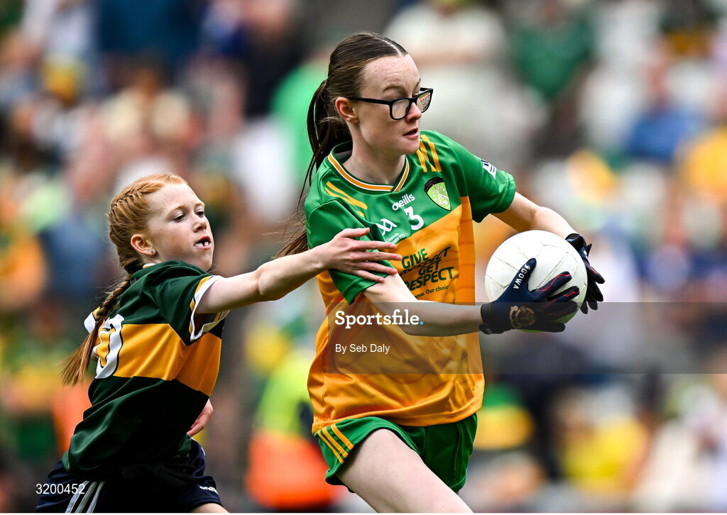 27 July 2025; Teegan Fahy, Clonberne NS, Clonberne, Galway, representing Donegal, in action against Bailee Bolton, St Fiacc's NS, Graiguecullen, Laois, representing Kerry, during the GAA INTO Cumann na mBunscol Respect Exhibition Go Games at the GAA Football All-Ireland Senior Championship final match between Kerry and Donegal at Croke Park in Dublin. Photo by Seb Daly/Sportsfile