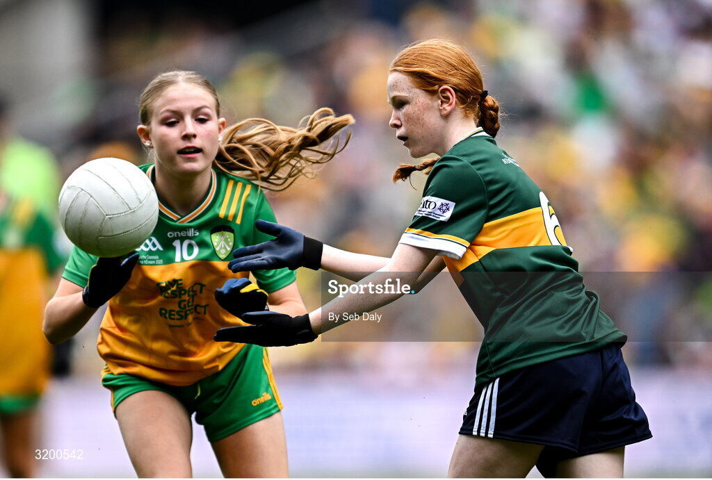 27 July 2025; Niamh Fanning, St Laurence O'Toole's NS, Roundwood, Wicklow, representing Kerry, in action against Rebecca Farrell, St Patrick's NS, Castleknock, Dublin, representing Donegal, during the GAA INTO Cumann na mBunscol Respect Exhibition Go Games at the GAA Football All-Ireland Senior Championship final match between Kerry and Donegal at Croke Park in Dublin. Photo by Seb Daly/Sportsfile