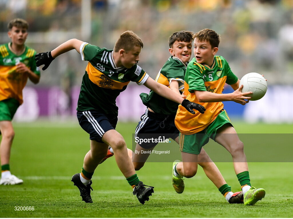 27 July 2025; Marc Ó Gairbhí, Gaelscoil Ultain, Baile Mhuineacháin, Co. Mhuineacháin, representing Donegal in action against Rogan Ó Móra, Gaelscoil an Mhuilinn, An Muileann gCearr, Iarmhí, representing Kerry during the GAA INTO Cumann na mBunscol Respect Exhibition Go Games at the GAA Football All-Ireland Senior Championship final match between Kerry and Donegal at Croke Park in Dublin. Photo by David Fitzgerald/Sportsfile