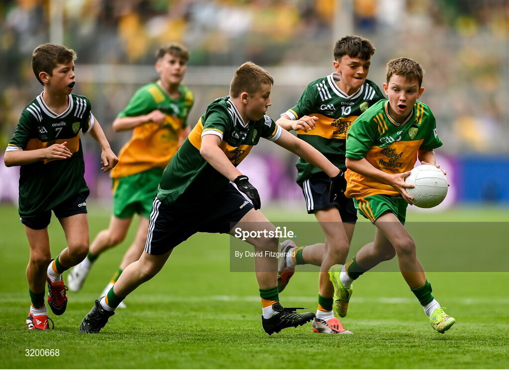 27 July 2025; Marc Ó Gairbhí, Gaelscoil Ultain, Baile Mhuineacháin, Co. Mhuineacháin, representing Donegal in action against Rogan Ó Móra, Gaelscoil an Mhuilinn, An Muileann gCearr, Iarmhí, representing Kerry during the GAA INTO Cumann na mBunscol Respect Exhibition Go Games at the GAA Football All-Ireland Senior Championship final match between Kerry and Donegal at Croke Park in Dublin. Photo by David Fitzgerald/Sportsfile