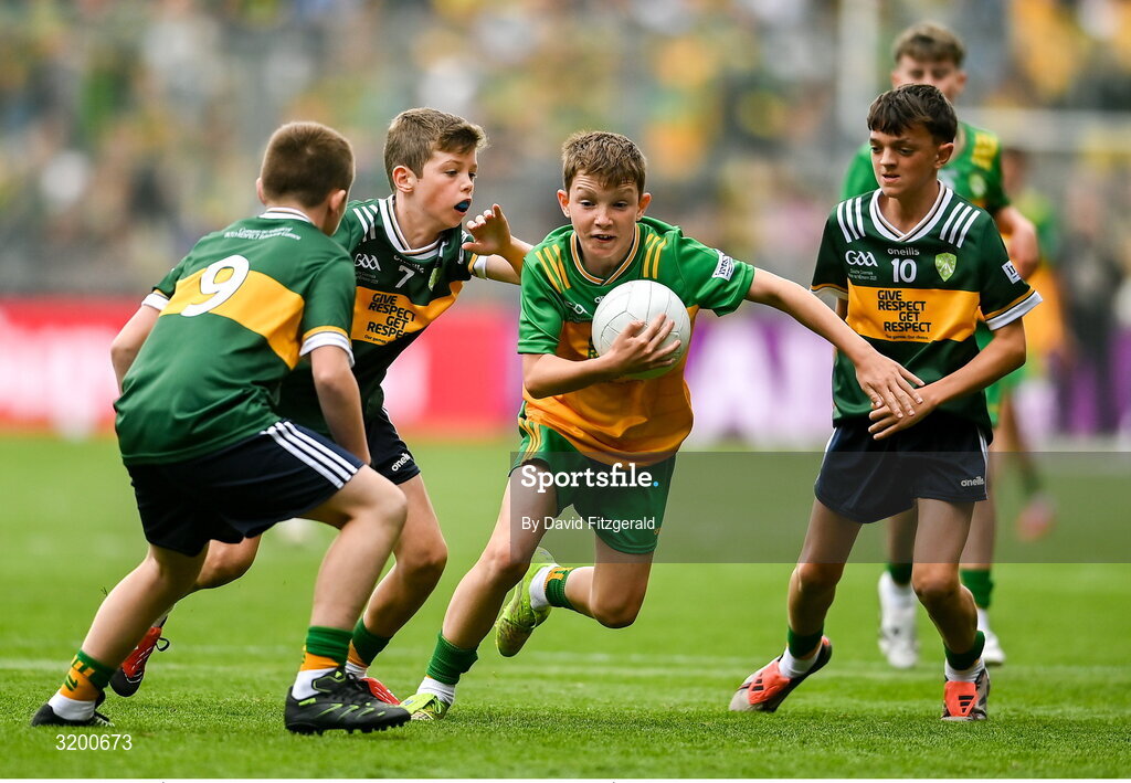 27 July 2025; Marc Ó Gairbhí, Gaelscoil Ultain, Baile Mhuineacháin, Co. Mhuineacháin, representing Donegal in action against Rogan Ó Móra, Gaelscoil an Mhuilinn, An Muileann gCearr, Iarmhí, representing Kerry during the GAA INTO Cumann na mBunscol Respect Exhibition Go Games at the GAA Football All-Ireland Senior Championship final match between Kerry and Donegal at Croke Park in Dublin. Photo by David Fitzgerald/Sportsfile