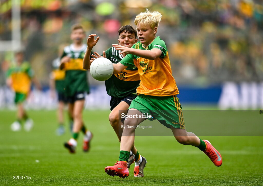 27 July 2025; Callan McGovern, St Kilian's SNS, Tallaght, Dublin, representing Donegal in action against James O'Toole, Scoil Phádraig Naofa, Tullow, Carlow, representing Kerry during the GAA INTO Cumann na mBunscol Respect Exhibition Go Games at the GAA Football All-Ireland Senior Championship final match between Kerry and Donegal at Croke Park in Dublin. Photo by David Fitzgerald/Sportsfile