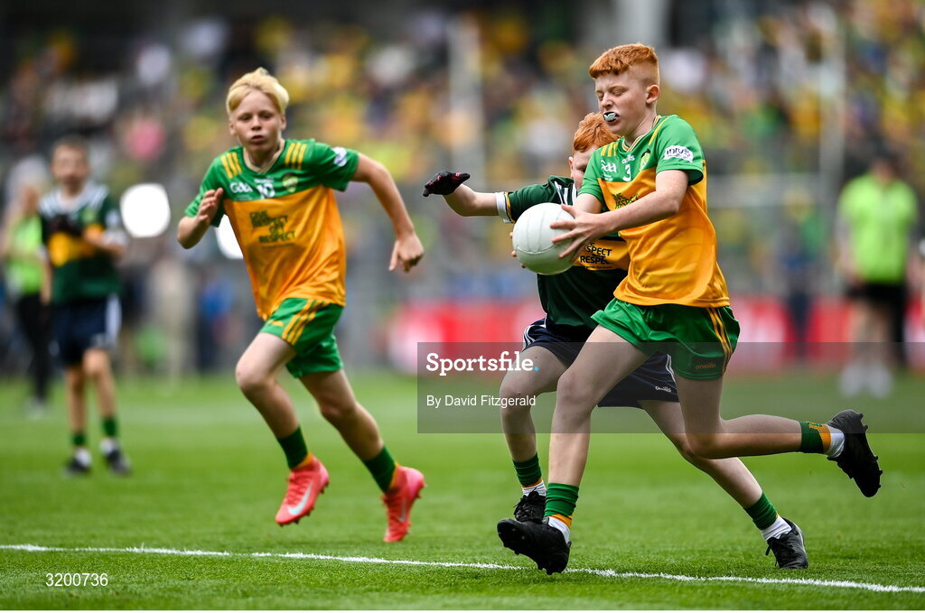 27 July 2025; Daithí Farrell, Scoil Bhríde, Fourmilehouse, Roscommon, representing Donegal in action against Michael Kenny, Casey Cloneen NS, Clonmel, Tipperary, representing Kerry during the GAA INTO Cumann na mBunscol Respect Exhibition Go Games at the GAA Football All-Ireland Senior Championship final match between Kerry and Donegal at Croke Park in Dublin. Photo by David Fitzgerald/Sportsfile