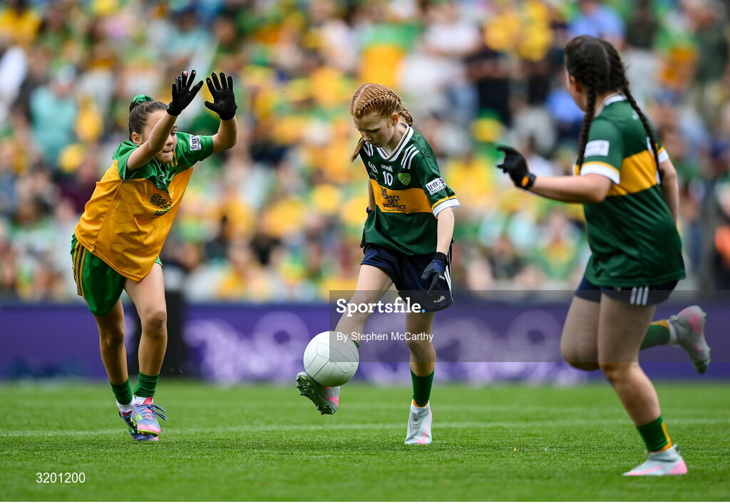 27 July 2025; Bailee Bolton, St Fiacc's NS, Graiguecullen, Laois, representing Kerry, and Grace McGonigle, Gaelscoil Cois Feabhaill, Moville, Donegal, during the GAA INTO Cumann na mBunscol Respect Exhibition Go Games at the GAA Football All-Ireland Senior Championship final match between Kerry and Donegal at Croke Park in Dublin. Photo by Stephen McCarthy/Sportsfile