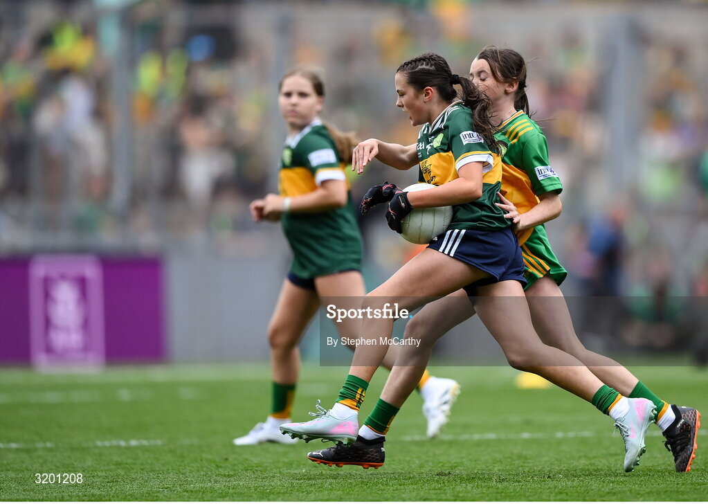 27 July 2025; Eabha Moynihan, Holy Family, Rathmore, Kerry, and Grainne Owens, St Matthew's PS, Castlewellan, Down, representing Donegal, during the GAA INTO Cumann na mBunscol Respect Exhibition Go Games at the GAA Football All-Ireland Senior Championship final match between Kerry and Donegal at Croke Park in Dublin. Photo by Stephen McCarthy/Sportsfile