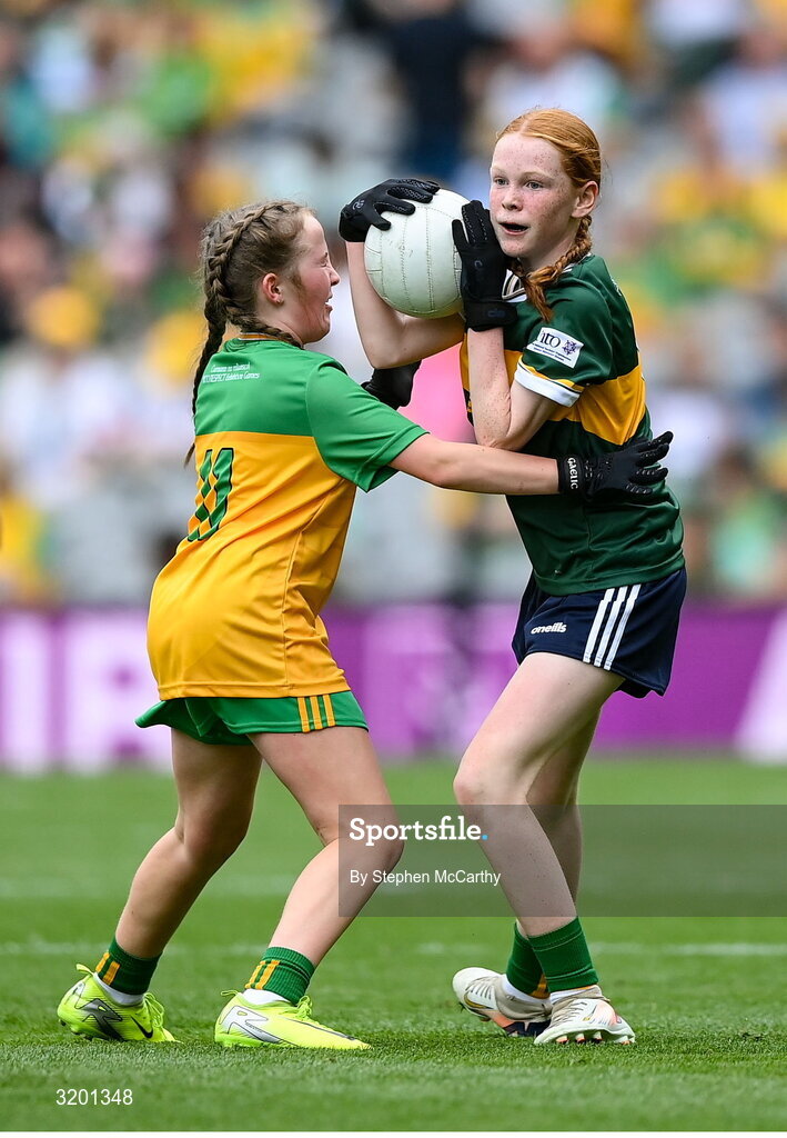 27 July 2025; Niamh Fanning, St Laurence O'Toole's NS, Roundwood, Wicklow, representing Kerry, and Avril Gilmartin, St Brigid's NS, Drumcong, Leitrim, representing Donegal, during the GAA INTO Cumann na mBunscol Respect Exhibition Go Games at the GAA Football All-Ireland Senior Championship final match between Kerry and Donegal at Croke Park in Dublin. Photo by Stephen McCarthy/Sportsfile