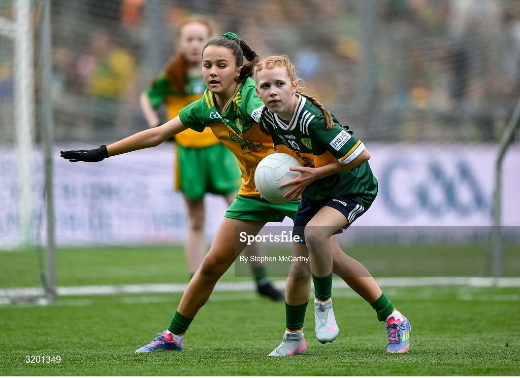 27 July 2025; Bailee Bolton, St Fiacc's NS, Graiguecullen, Laois, representing Kerry, and Grace McGonigle, Gaelscoil Cois Feabhaill, Moville, Donegal, during the GAA INTO Cumann na mBunscol Respect Exhibition Go Games at the GAA Football All-Ireland Senior Championship final match between Kerry and Donegal at Croke Park in Dublin. Photo by Stephen McCarthy/Sportsfile