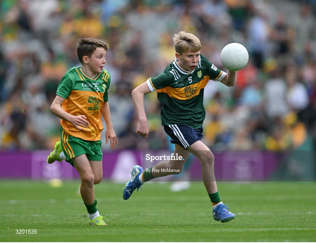 27 July 2025; Keelan Sweeney, St Andrews National School Curragha, representing Meath, in action against Marc Ó Gairbhí, Gaelscoil Ultain, Baile Mhuineacháin, Co. Mhuineacháin, representing Donegal, during the GAA INTO Cumann na mBunscol Respect Exhibition Go Games at the GAA Football All-Ireland Senior Championship final match between Kerry and Donegal at Croke Park in Dublin. Photo by Ray McManus/Sportsfile