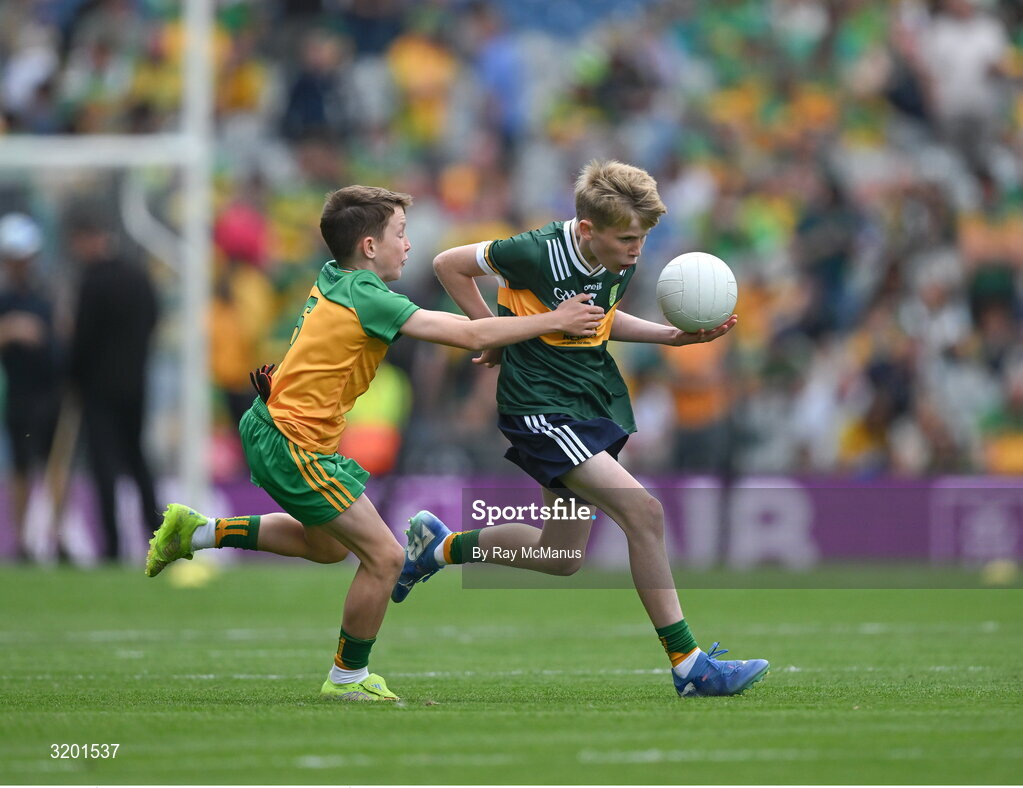 27 July 2025; Marc Ó Gairbhí, Gaelscoil Ultain, Baile Mhuineacháin, Co. Mhuineacháin, representing Kerry, is tackled by Marc Ó Gairbhí, Gaelscoil Ultain, Baile Mhuineacháin, Co. Mhuineacháin, representing Donegal, during the GAA INTO Cumann na mBunscol Respect Exhibition Go Games at the GAA Football All-Ireland Senior Championship final match between Kerry and Donegal at Croke Park in Dublin. Photo by Ray McManus/Sportsfile