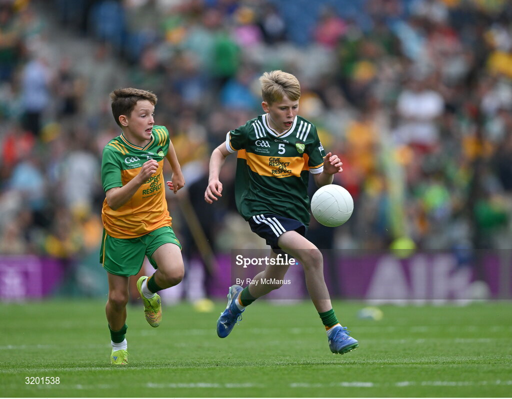 27 July 2025; Keelan Sweeney, St Andrews National School Curragha, representing Meath, in action against Marc Ó Gairbhí, Gaelscoil Ultain, Baile Mhuineacháin, Co. Mhuineacháin, representing Donegal, during the GAA INTO Cumann na mBunscol Respect Exhibition Go Games at the GAA Football All-Ireland Senior Championship final match between Kerry and Donegal at Croke Park in Dublin. Photo by Ray McManus/Sportsfile