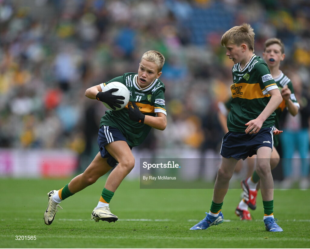 27 July 2025; CJ Burke, St Joseph's National School, Mardyke, Cork, representing Kerry, and Marc Ó Gairbhí, Gaelscoil Ultain, Baile Mhuineacháin, Co. Mhuineacháin, representing Kerry, right, during the GAA INTO Cumann na mBunscol Respect Exhibition Go Games at the GAA Football All-Ireland Senior Championship final match between Kerry and Donegal at Croke Park in Dublin. Photo by Ray McManus/Sportsfile