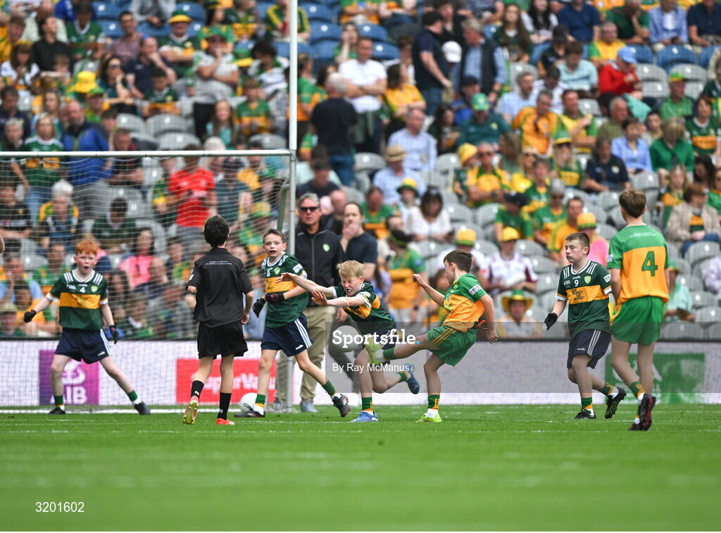 27 July 2025; Marc Ó Gairbhí, Gaelscoil Ultain, Baile Mhuineacháin, Co. Mhuineacháin, representing Donegal, has a shot blocked by Keelan Sweeney, St Andrews National School Curragha, representing Meath, during the GAA INTO Cumann na mBunscol Respect Exhibition Go Games at the GAA Football All-Ireland Senior Championship final match between Kerry and Donegal at Croke Park in Dublin. Photo by Ray McManus/Sportsfile
