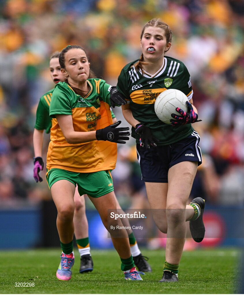 27 July 2025; Eimear Farrell, St Oliver Plunkett PS, Blackcastle, Meath, representing Kerry, and Grace McGonigle, Gaelscoil Cois Feabhaill, Moville, Donegal, during the GAA INTO Cumann na mBunscol Respect Exhibition Go Games at the GAA Football All-Ireland Senior Championship final match between Kerry and Donegal at Croke Park in Dublin. Photo by Ramsey Cardy/Sportsfile