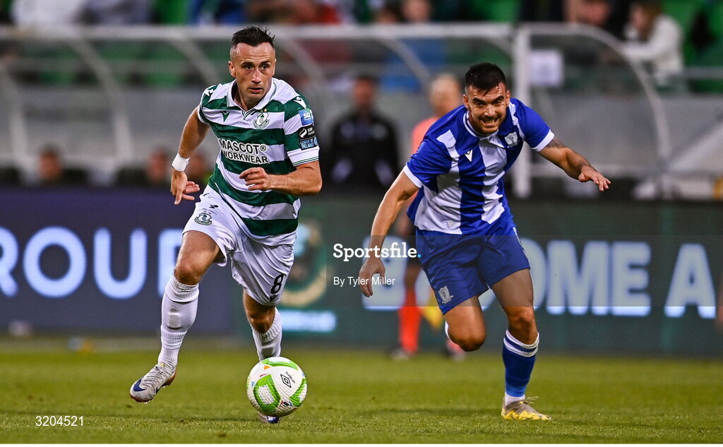 31 July 2025; Aaron McEneff of Shamrock Rovers in action against Javi Forján of St Joseph's during the UEFA Conference League Second Qualifying Round second leg match between Shamrock Rovers and St Joseph's at Tallaght Stadium in Dublin. Photo by Tyler Miller/Sportsfile