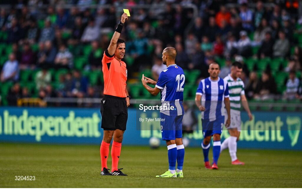 31 July 2025; Referee Granit Maqedonci issues a yellow card to Angel Martinez of St Joseph's during the UEFA Conference League Second Qualifying Round second leg match between Shamrock Rovers and St Joseph's at Tallaght Stadium in Dublin. Photo by Tyler Miller/Sportsfile