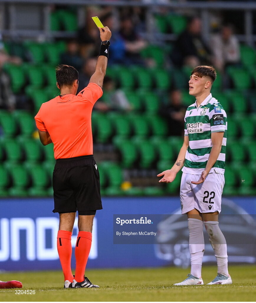 31 July 2025; Referee Granit Maqedonci issues a yellow card to Cian Barrett of Shamrock Rovers during the UEFA Conference League Second Qualifying Round second leg match between Shamrock Rovers and St Joseph's at Tallaght Stadium in Dublin. Photo by Stephen McCarthy/Sportsfile