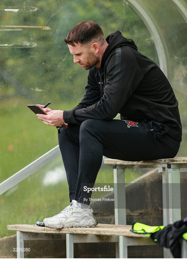 1 August 2025; Dundalk manager Ciarán Kilduff sits in the dugout before the SSE Airtricity Men's First Division match between UCD and Dundalk at UCD Bowl in Belfield, Dublin. Photo by Thomas Flinkow/Sportsfile