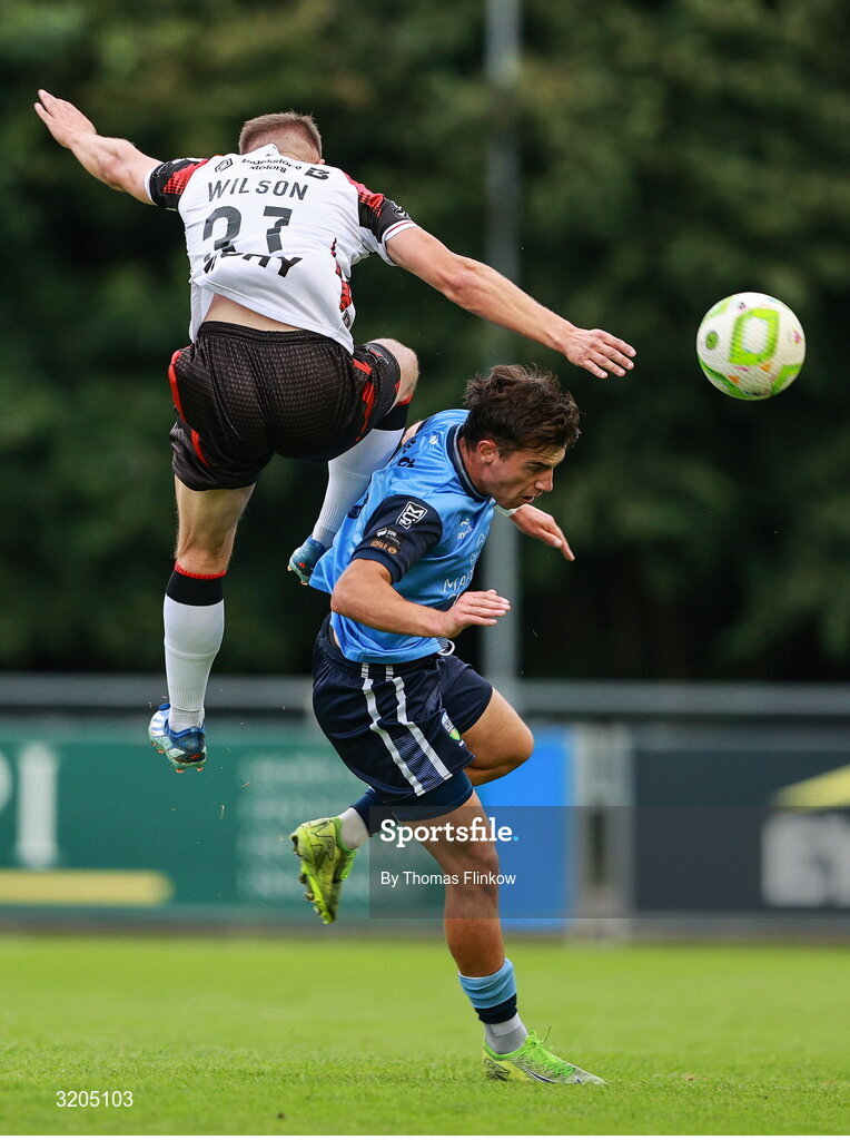 1 August 2025; Mikey McCullagh of UCD in action against John Ross Wilson of Dundalk during the SSE Airtricity Men's First Division match between UCD and Dundalk at UCD Bowl in Belfield, Dublin. Photo by Thomas Flinkow/Sportsfile