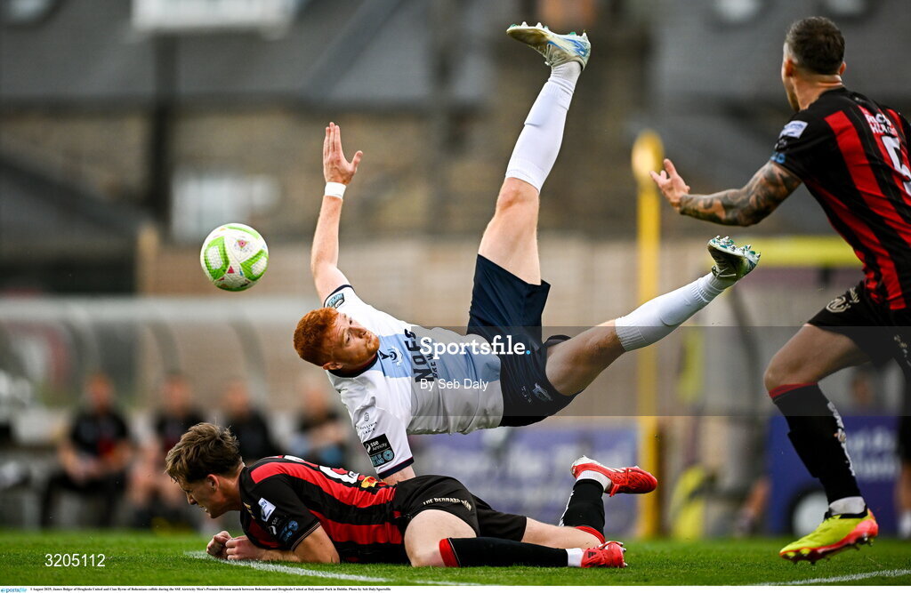 1 August 2025; James Bolger of Drogheda United and Cian Byrne of Bohemians collide during the SSE Airtricity Men's Premier Division match between Bohemians and Drogheda United at Dalymount Park in Dublin. Photo by Seb Daly/Sportsfile