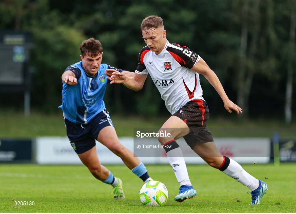 1 August 2025; John Ross Wilson of Dundalk in action against Mikey McCullagh of UCD during the SSE Airtricity Men's First Division match between UCD and Dundalk at UCD Bowl in Belfield, Dublin. Photo by Thomas Flinkow/Sportsfile